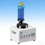 Compact desktop powder feeder with agitation system and low-powder alarm for laser cladding applications