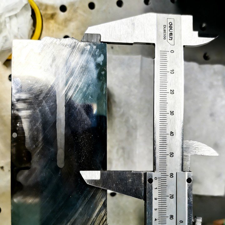 High-power fiber laser deep penetration weld on metallic component showing melt pool depth